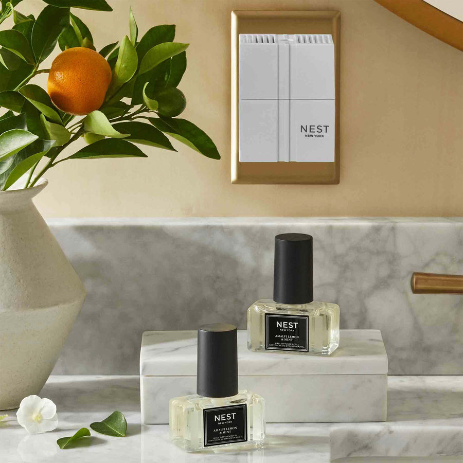 Amalfi Lemon & Mint Refills for Wall Diffuser by NEST New York with wall diffuser and lemon plant