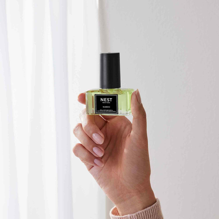 Bamboo Refills for Wall Diffuser by NEST New York with hand model