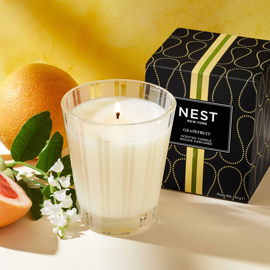 Grapefruit Classic Candle by NEST New York with grapefruit and flowers