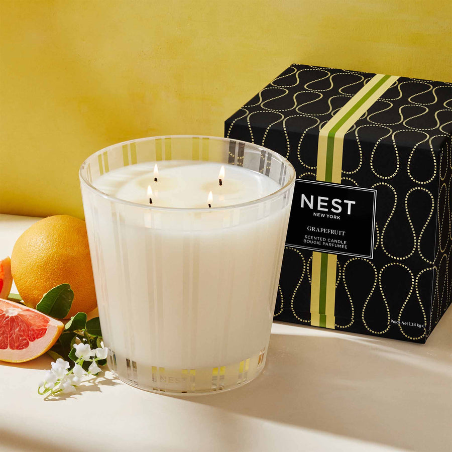 Grapefruit Luxury Candle by NEST New York with grapefruit and flowers