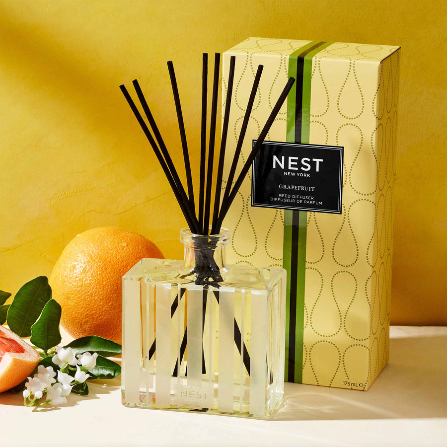 Grapefruit Reed Diffuser by NEST New York with grapefruit and flowers