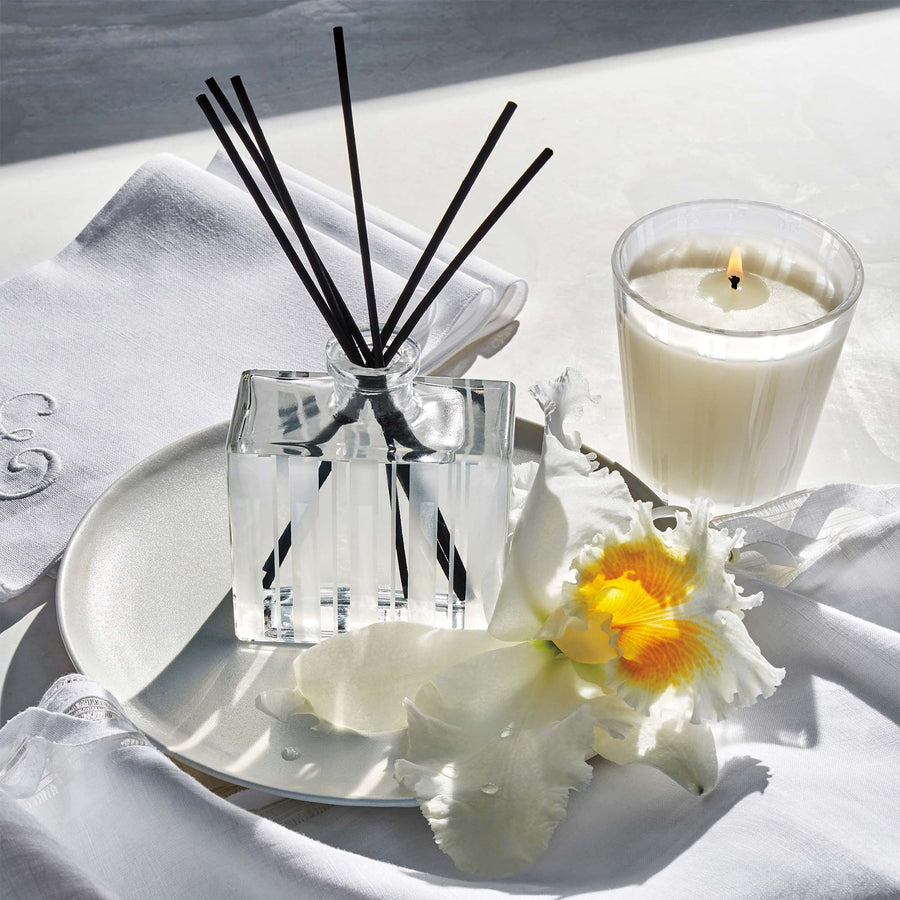 Linen Reed Diffuser and Classic Candle by NEST New York with napkins and flower