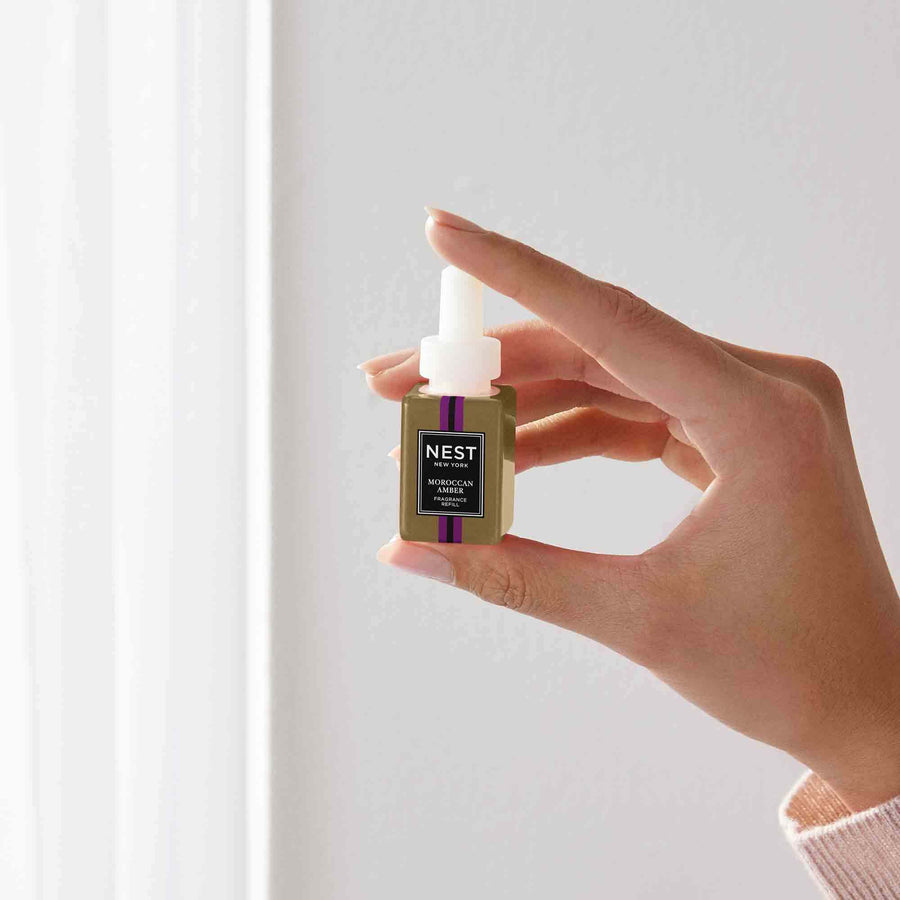 Moroccan Amber Pura Refill by NEST New York with hand model