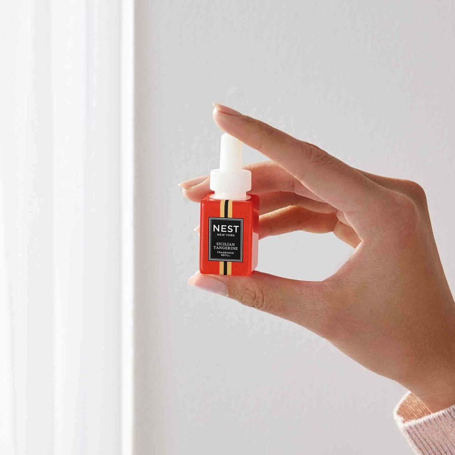 Sicilian Tangerine Pura Refill by NEST New York with hand model