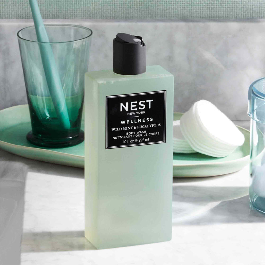 Wild Mint & Eucalyptus Body Wash by NEST New York with cotton rounds and cup