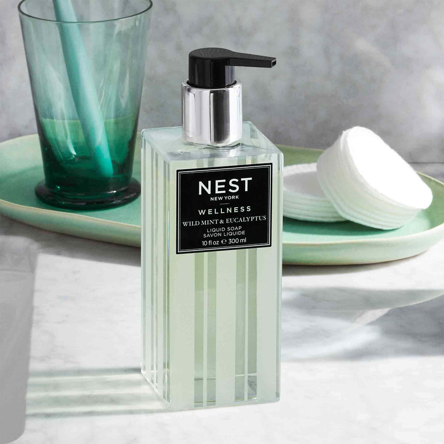 Wild Mint & Eucalyptus Liquid Soap by NEST New York with cotton rounds and cup