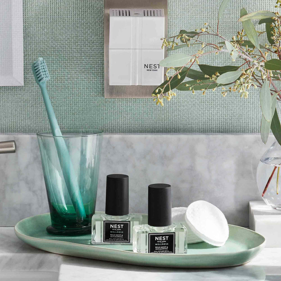 Wild Mint & Eucalyptus Refills for Wall Diffuser by NEST New York with diffuser, cotton rounds and toothbrush