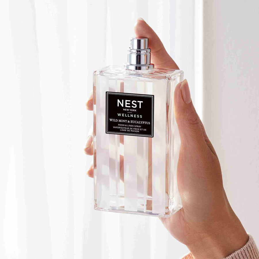 Wild Mint & Eucalyptus Room & Linen Spray by NEST New York with hand model